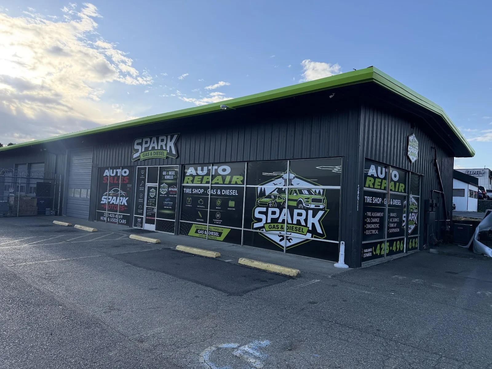 The Spark shop on 16th Ave S: black siding, lime green trim and the SPARK badge on the windows